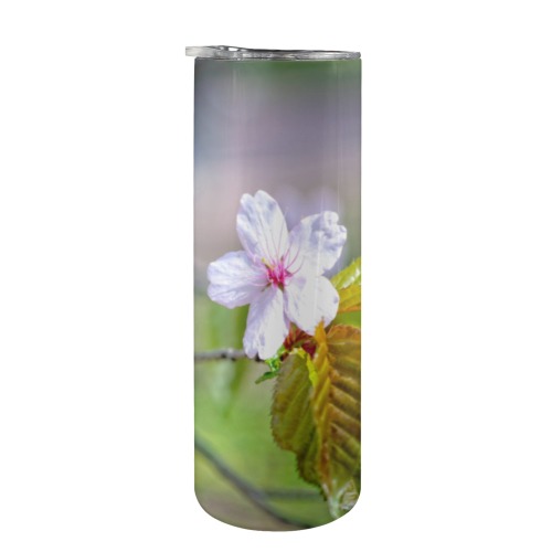 One sakura cherry flowers on a tree in spring. 20oz Tall Skinny Tumbler with Lid and Straw