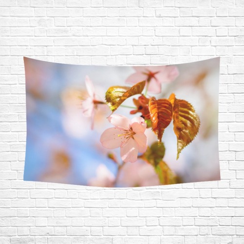 Orange leaves and pink petals of sakura cherry.