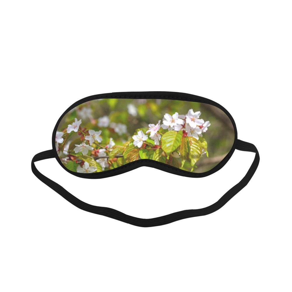 A row of sakura cherry flowers on a tree in spring Sleeping Mask