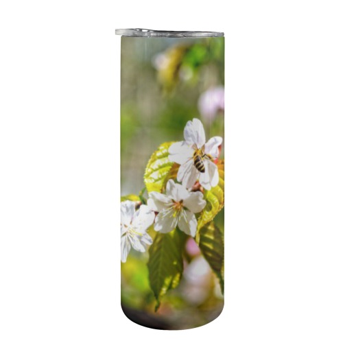 Small bee on a sakura flowers on a sunny day. 20oz Tall Skinny Tumbler with Lid and Straw