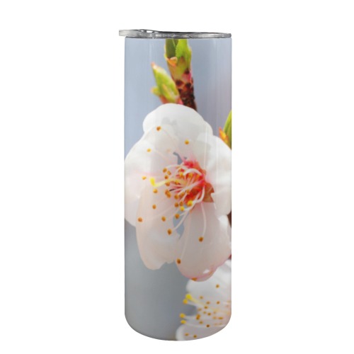 Magnificent Japanese apricot flowers on a tree. 20oz Tall Skinny Tumbler with Lid and Straw