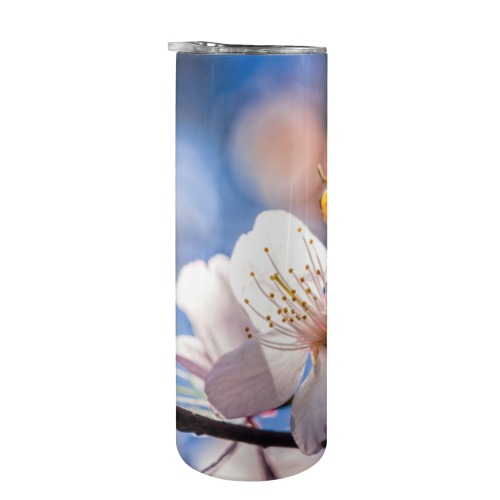 Sunlit sakura cherry flower in the tree shadow. 20oz Tall Skinny Tumbler with Lid and Straw